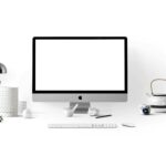 silver imac near white ceramic kettle