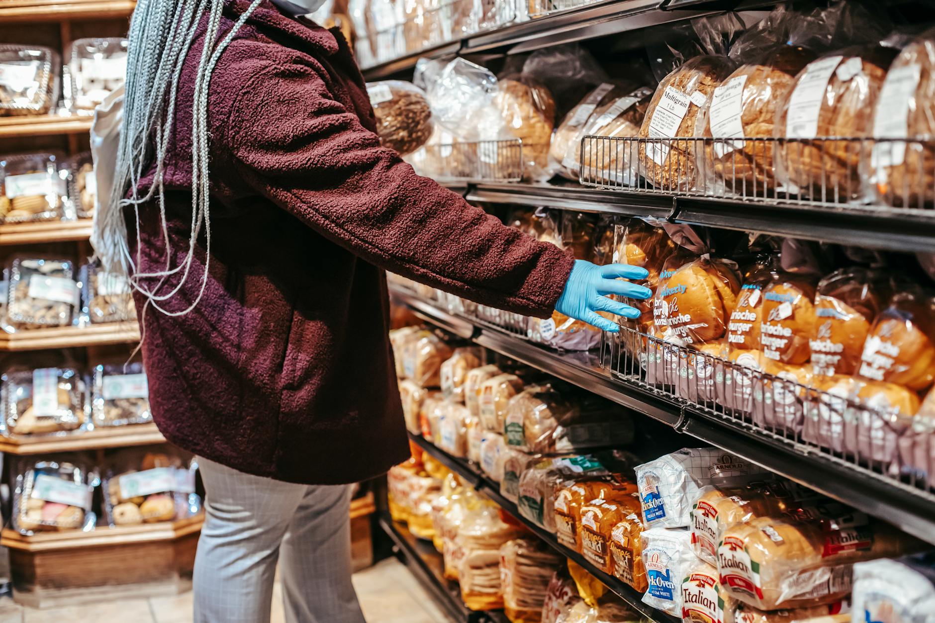 woman shopping in grocery market during pandemic